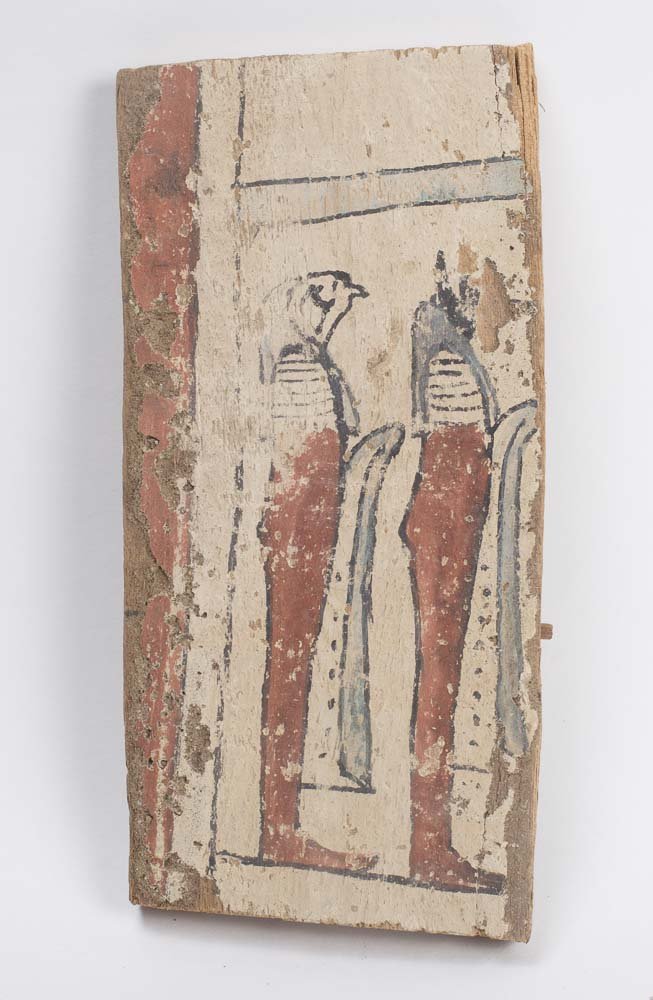 Ancient Egyptian Wood Panel Late Period c.600 BC.: Ancient Egyptian Wood Panel Late Period c.600 BC. Size 9 7/8 inches high x 4 3/4 inches wide. A wooden fragment from a sarcophagus panel with painted red and white gesso of the two Sons of Horus. Mino