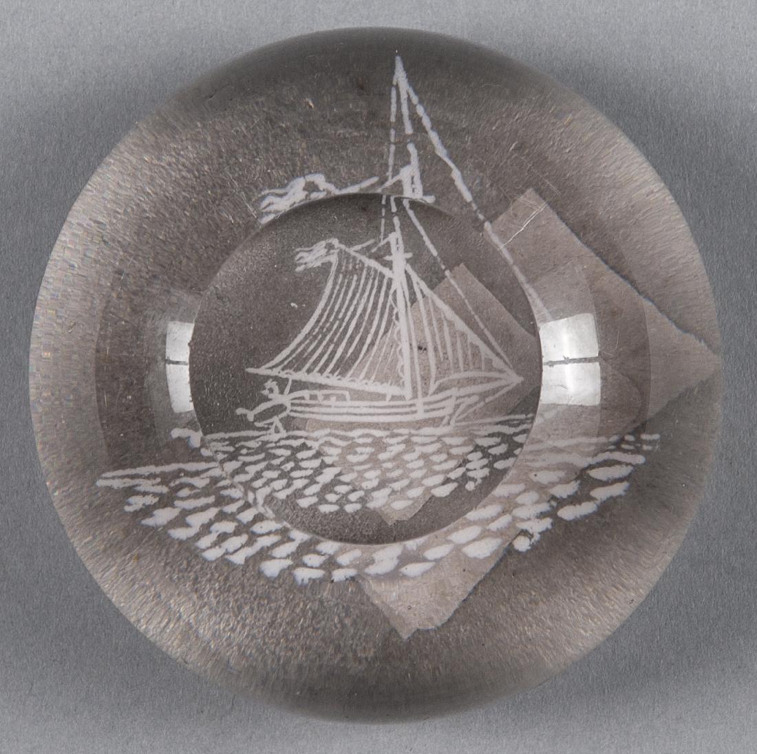 White frit paperweight, with a sloop, the top fac: White frit paperweight, with a sloop, the top facet with a frosted base, 3 1/8'' dia.