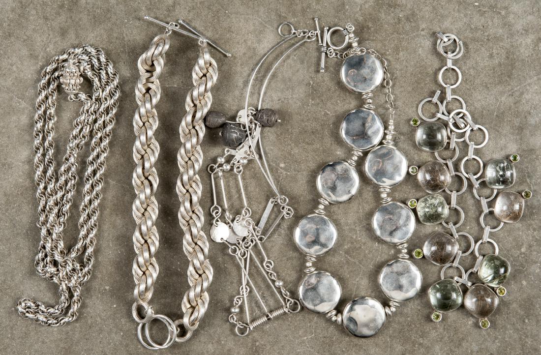 Sterling silver and white metal jewelry, to inclu: Sterling silver and white metal jewelry, to include two heavy chain bracelets, a chain necklace, a necklace set with glass and green stones, and two other necklaces, 5.26 weighable ozt.