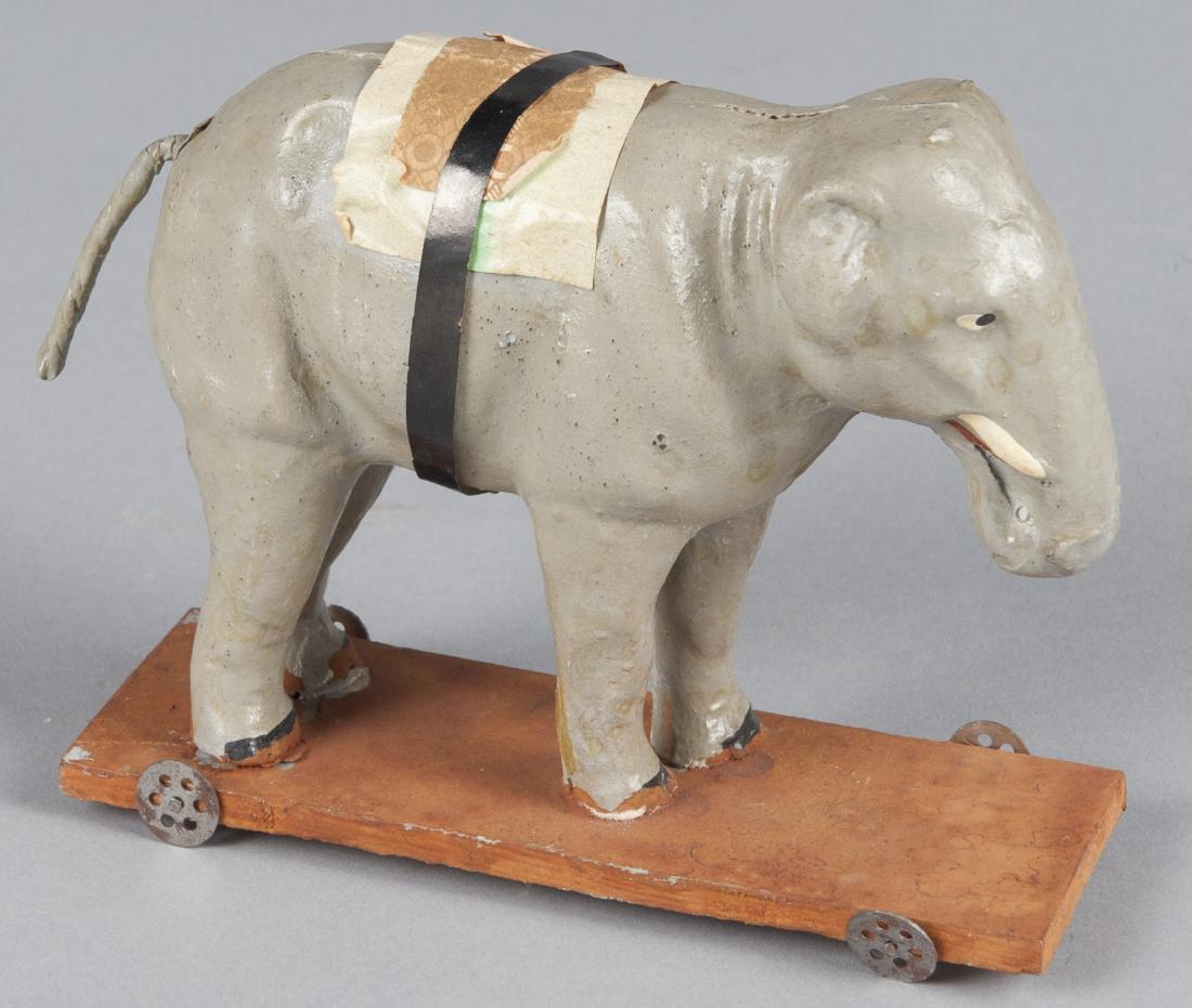 German composition elephant pull toy on a wood pl (1 of 1)