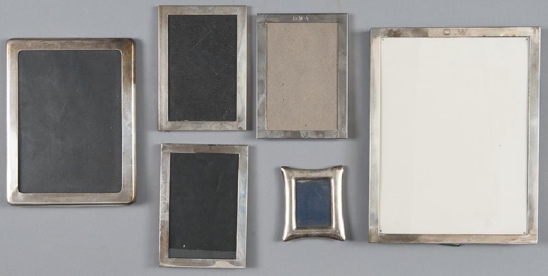 Six sterling silver picture frames, the smallest: Six sterling silver picture frames, the smallest by Tiffany, largest - 12'' x 9 1/4''.