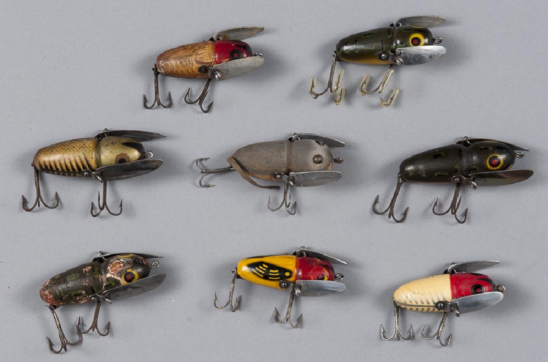 Eight Heddon crazy crawler wood fishing lures, to: Eight Heddon crazy crawler wood fishing lures, to include a chipmunk pattern, longest - 2 3/4''.