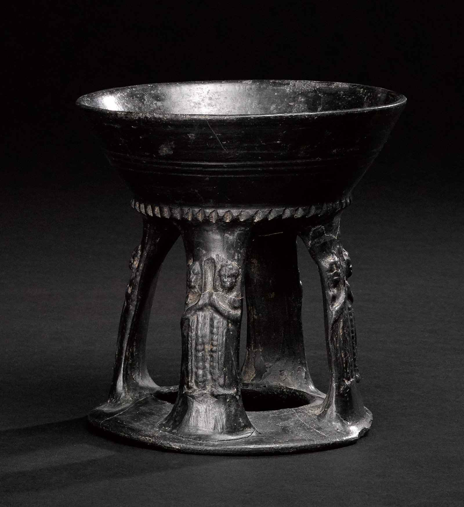 Etruscan bucchero chalice: Etruscan bucchero chalice, 6th-5th c. B.C., with a four-part stem with figures on each stem, 6 5/8'' h.
