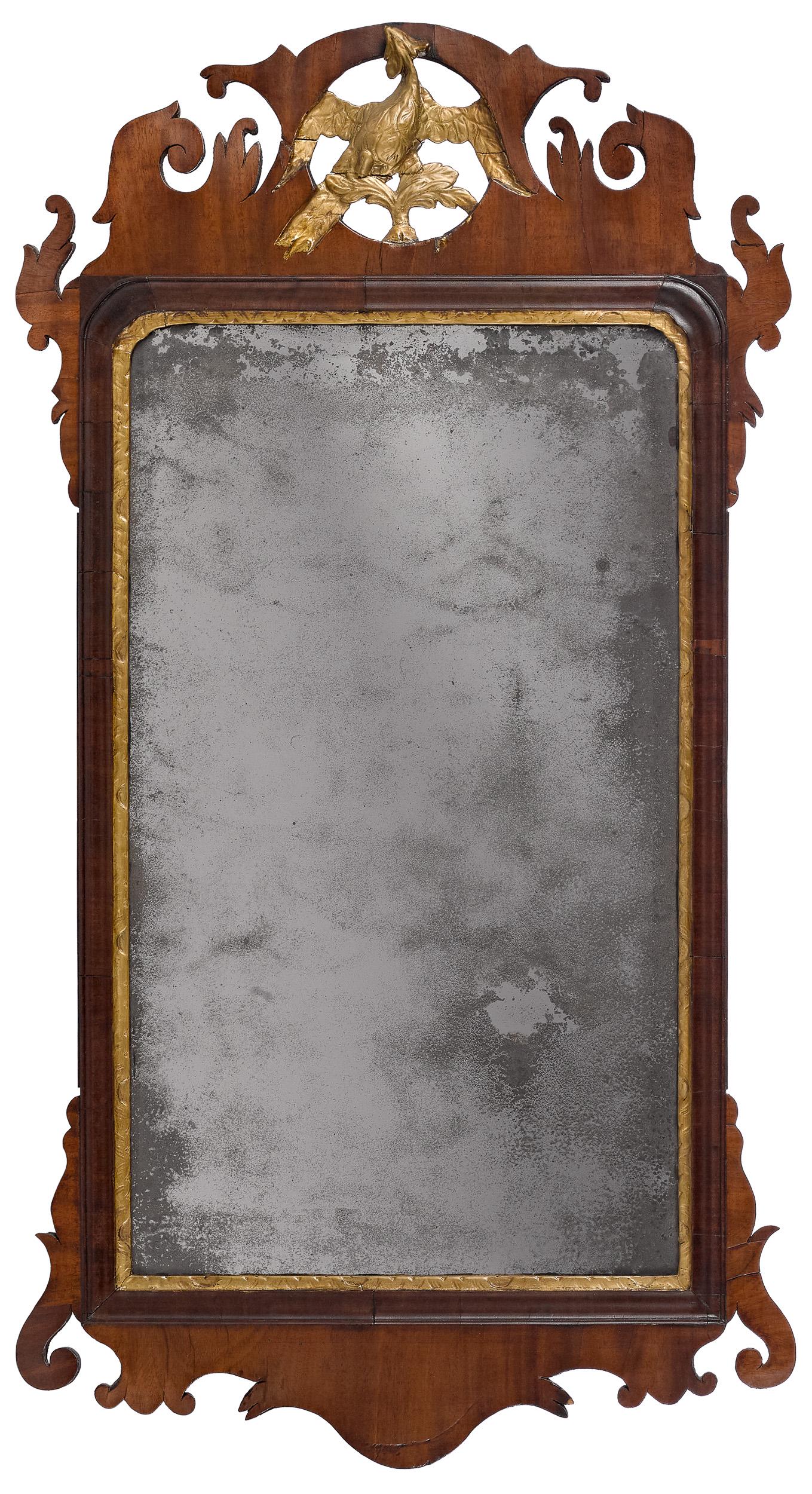 Chippendale mahogany looking glass: Chippendale mahogany looking glass, late 18th c., with parcel gilt phoenix crest, 35 3/4'' x 19''. Provenance: Franklin Rappold, Frederick, Maryland; The Collection of Daniel Heisler and Mary Jane She