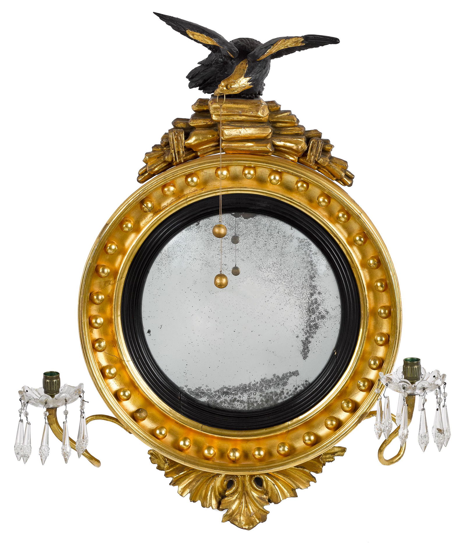 Small giltwood convex mirror: Small giltwood convex mirror, ca. 1800, with ebonized eagle crest and two candlearms, 29'' x 23''. Provenance: The Collection of Daniel Heisler and Mary Jane Sheppard, Lutherville, MD.