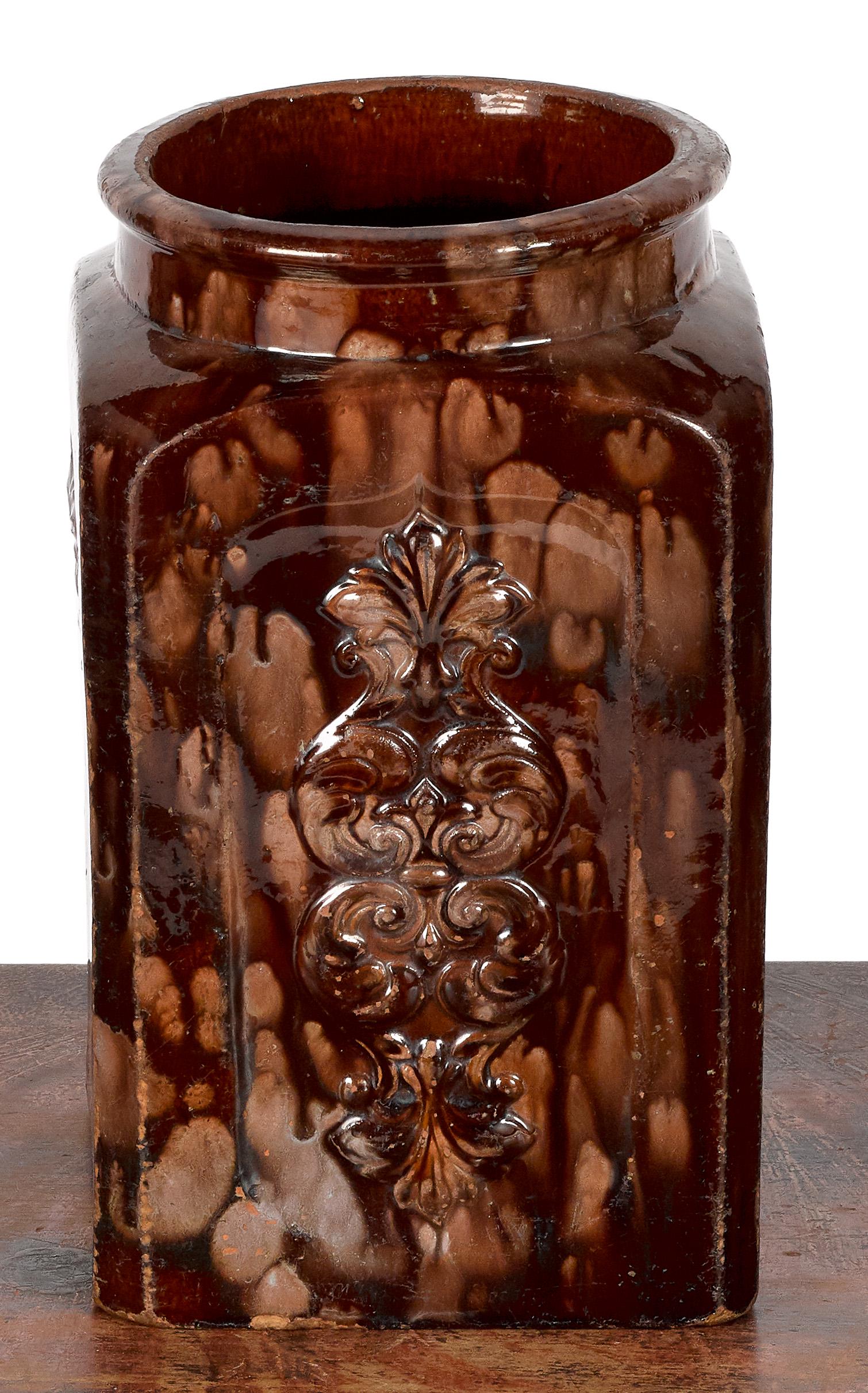 Lancaster, Pennsylvania redware jar: Lancaster, Pennsylvania redware jar, 19th c., impressed Henry Swope Pottery, with embossed floral panels, 10 1/2'' h. Provenance: Collection of Mr. and Mrs. Dennis Cox, Pennsylvania.