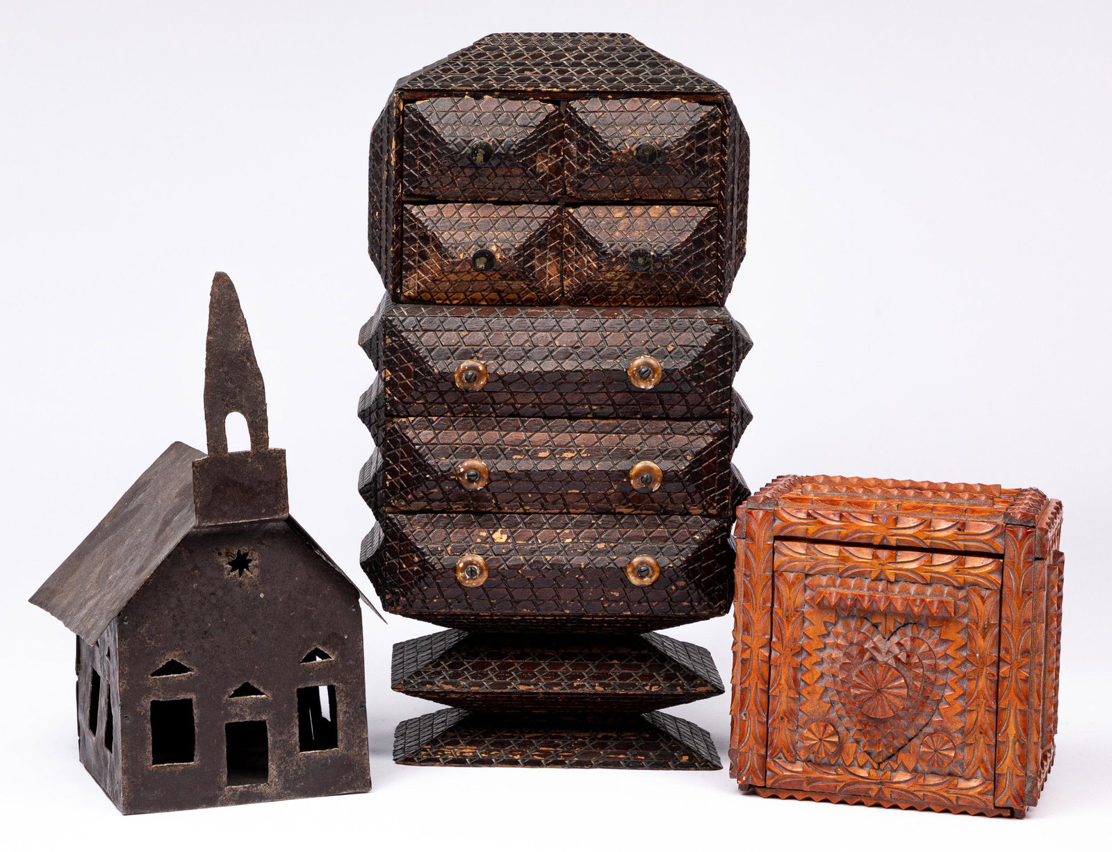 Two tramp art dresser boxes, etc.: Two tramp art dresser boxes, 4 1/2'' h., 6 3/4'' w. and 17'' h., 9'' w., together with a folk art metal church, 12'' h., 7 1/4'' w.