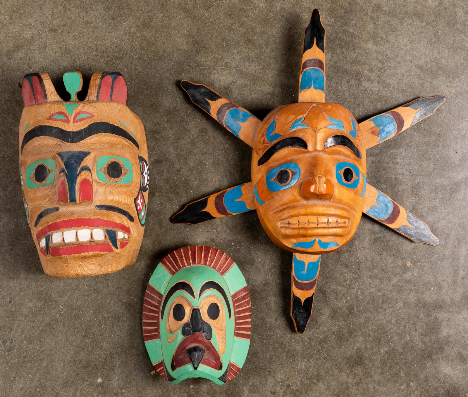 Three Northwest Coast carved cedar masks: Three Northwest Coast carved cedar masks, two signed Chief Ben, the third G. Morrison, tallest - 17''.