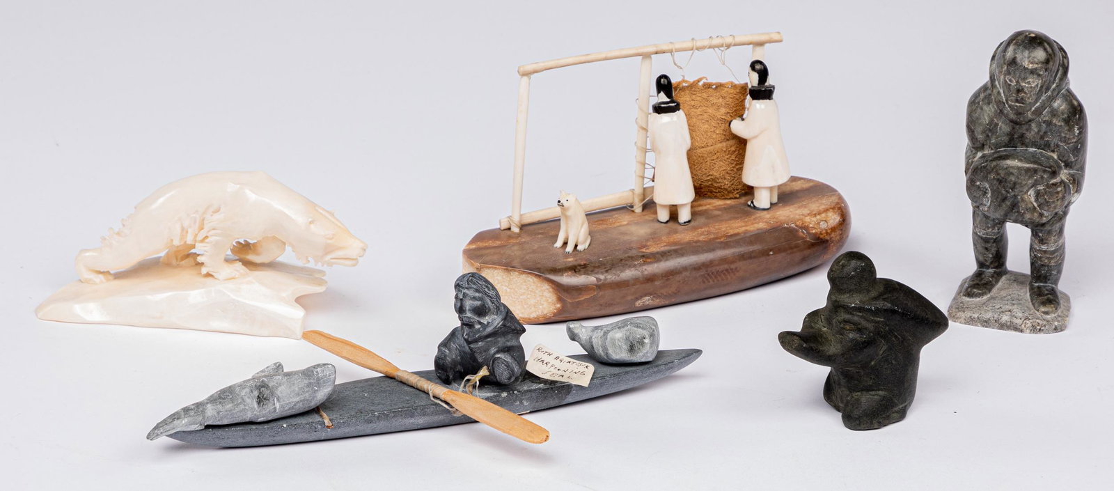 Five Inuit stone and bone carvings: Five Inuit stone and bone carvings, largest - 8 3/4'' l.