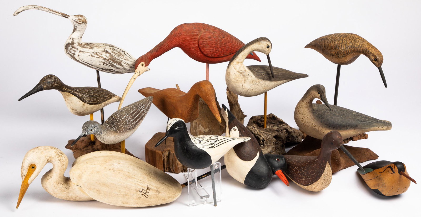 Twelve carved and painted shorebird decoys: Twelve contemporary carved and painted shorebird decoys, to include Oler, Van Dyck, Roe, James Long, Bob Booth, Wallace Spencer, etc.