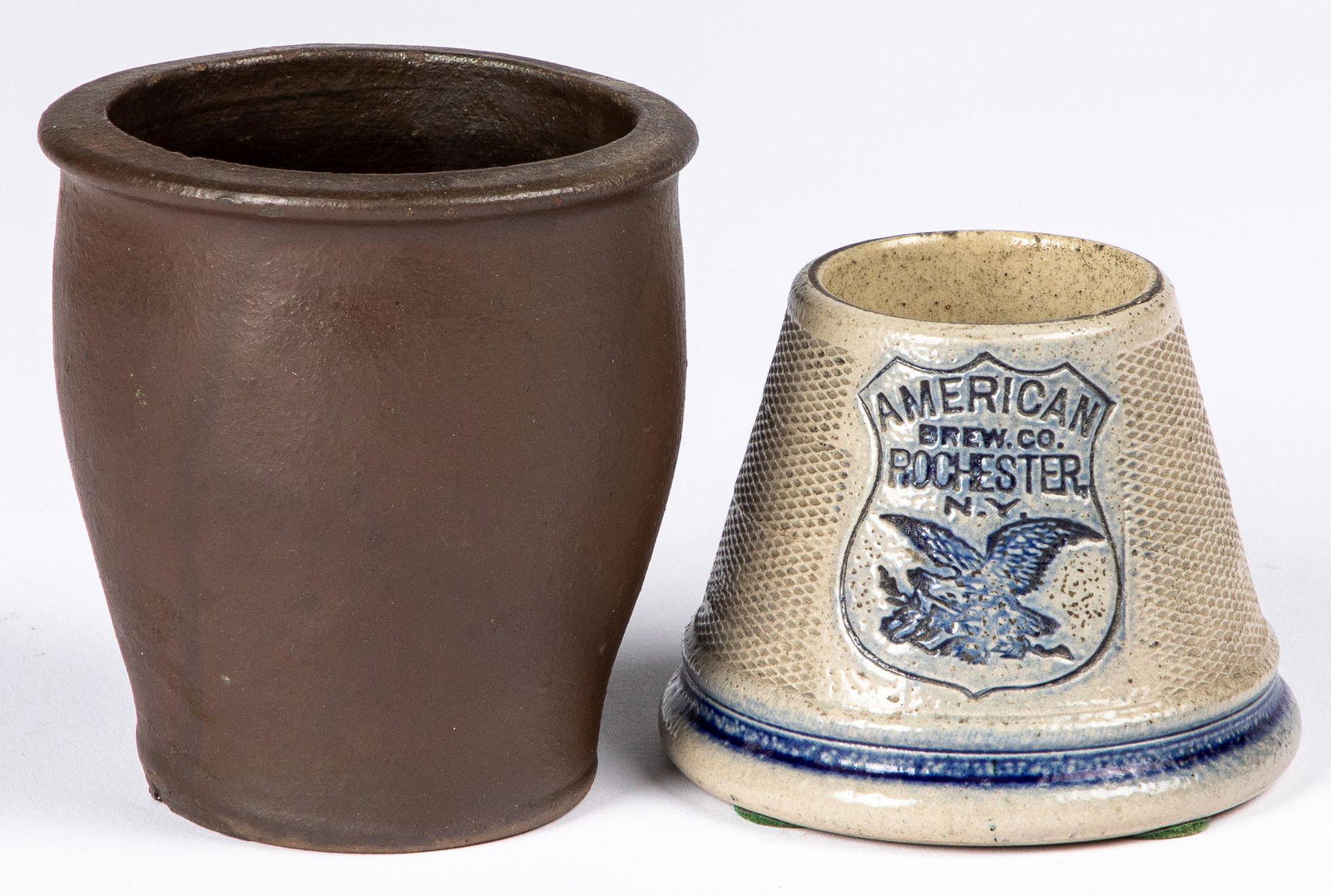 American Brew Co., match safe, etc.: American Brew Co., Rochester, NY, stoneware match safe, late 19th c., 3'' h., together with a small redware crock, 4 1/8'' h