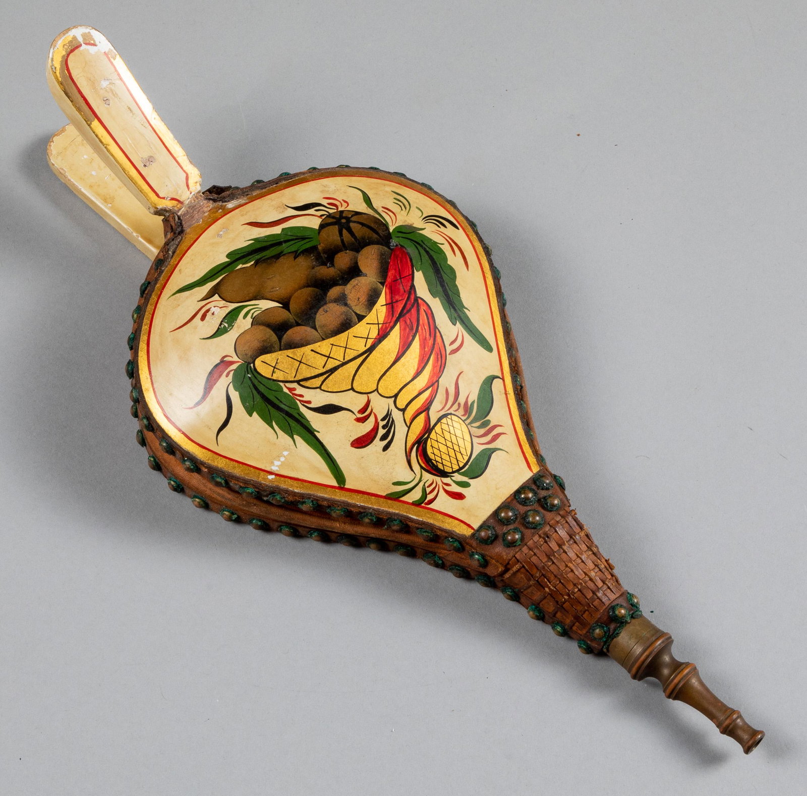 Vibrant New England painted bellows: Vibrant New England painted bellows, late 19th c., retaining the original cornucopia of fruit on a painted surface, 17'' l.