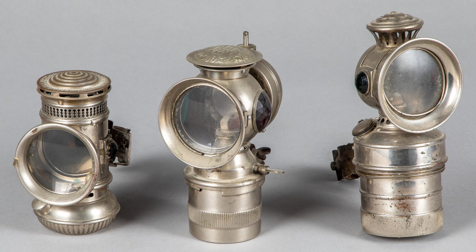 Three bicycle lamps: Three bicycle lamps, to include E. M. & Co. The Leader, Search Light and Badger Brass Mfg. Co. Solar, tallest - 7 1/2''.