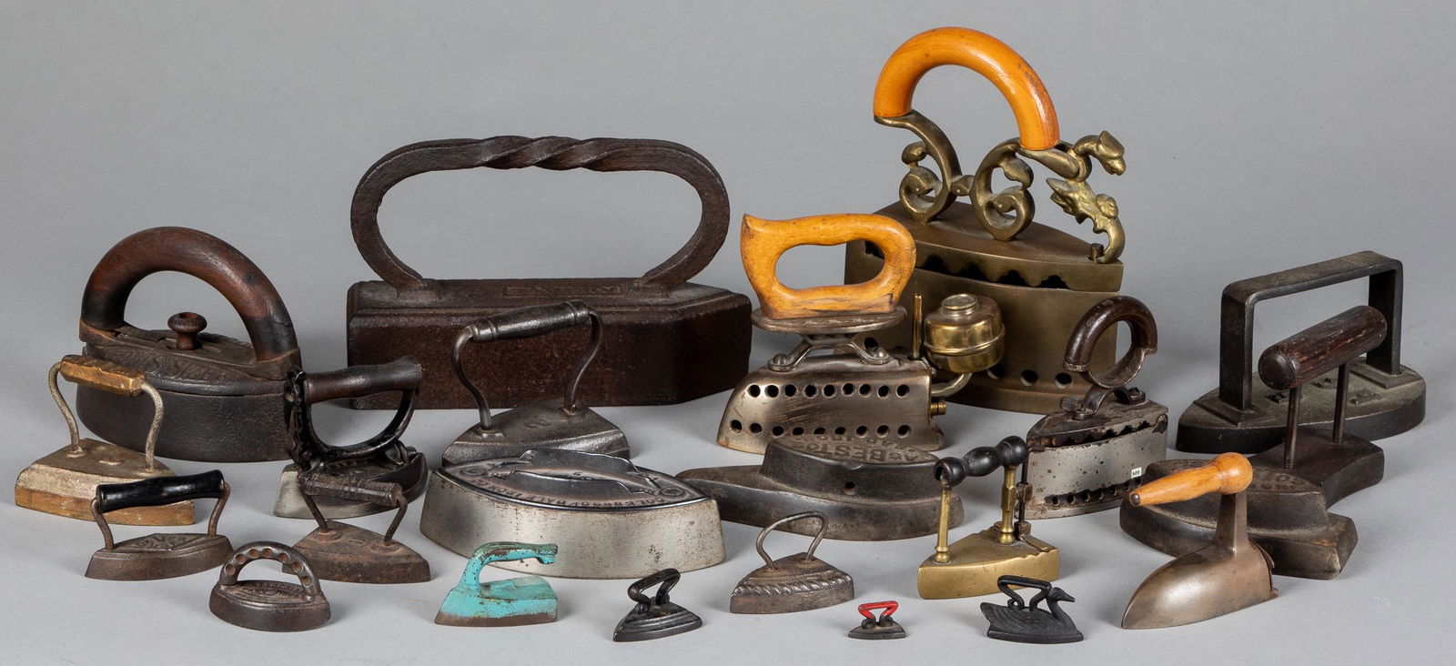 Collection of twenty-three cast iron sad irons: Collection of twenty-three cast iron sad irons, 19th/20th c., to include miniatures.