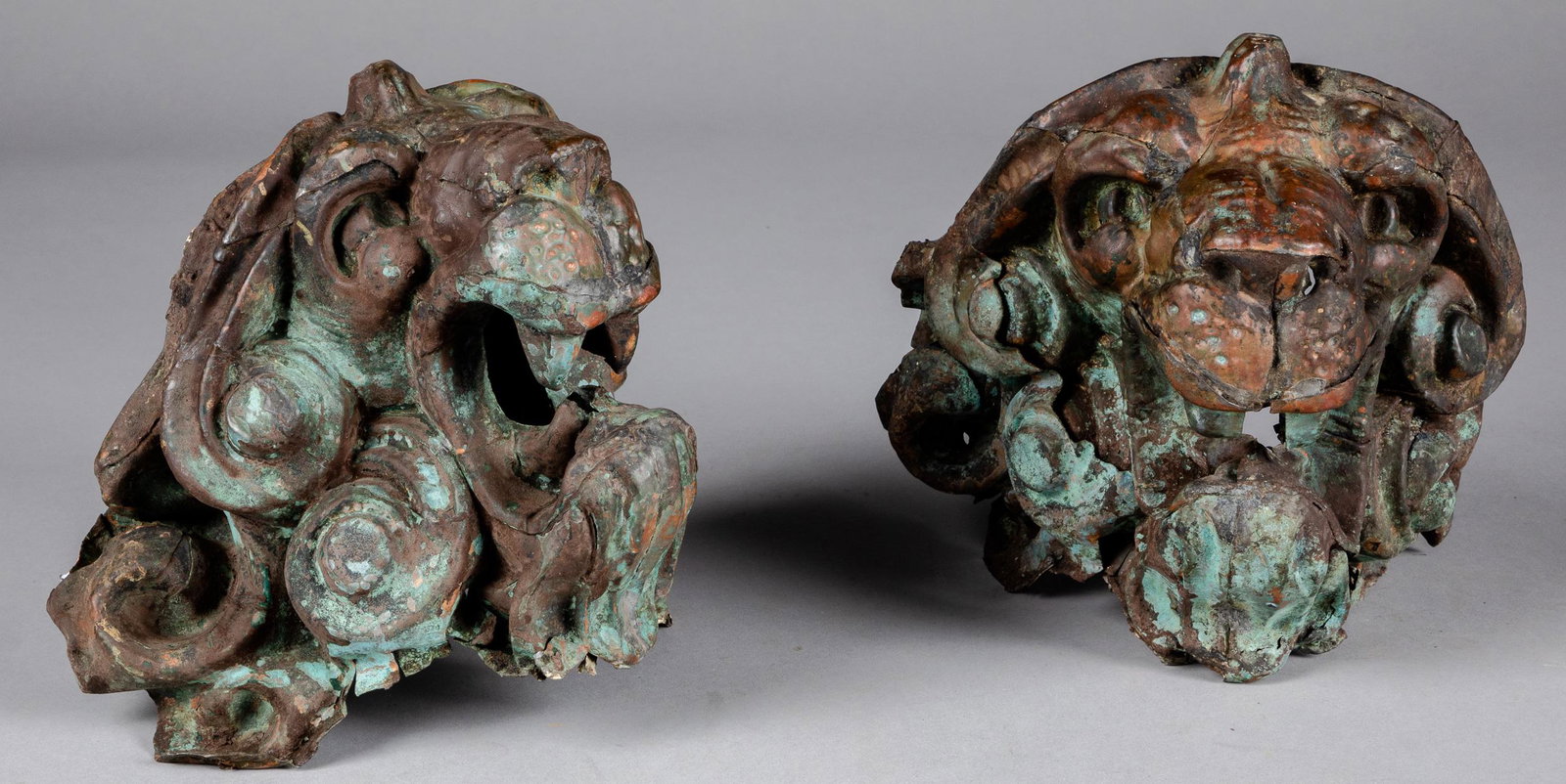 Pair of copper lion mask architectural elements: Pair of copper lion mask architectural elements, 19th c., 10'' h.