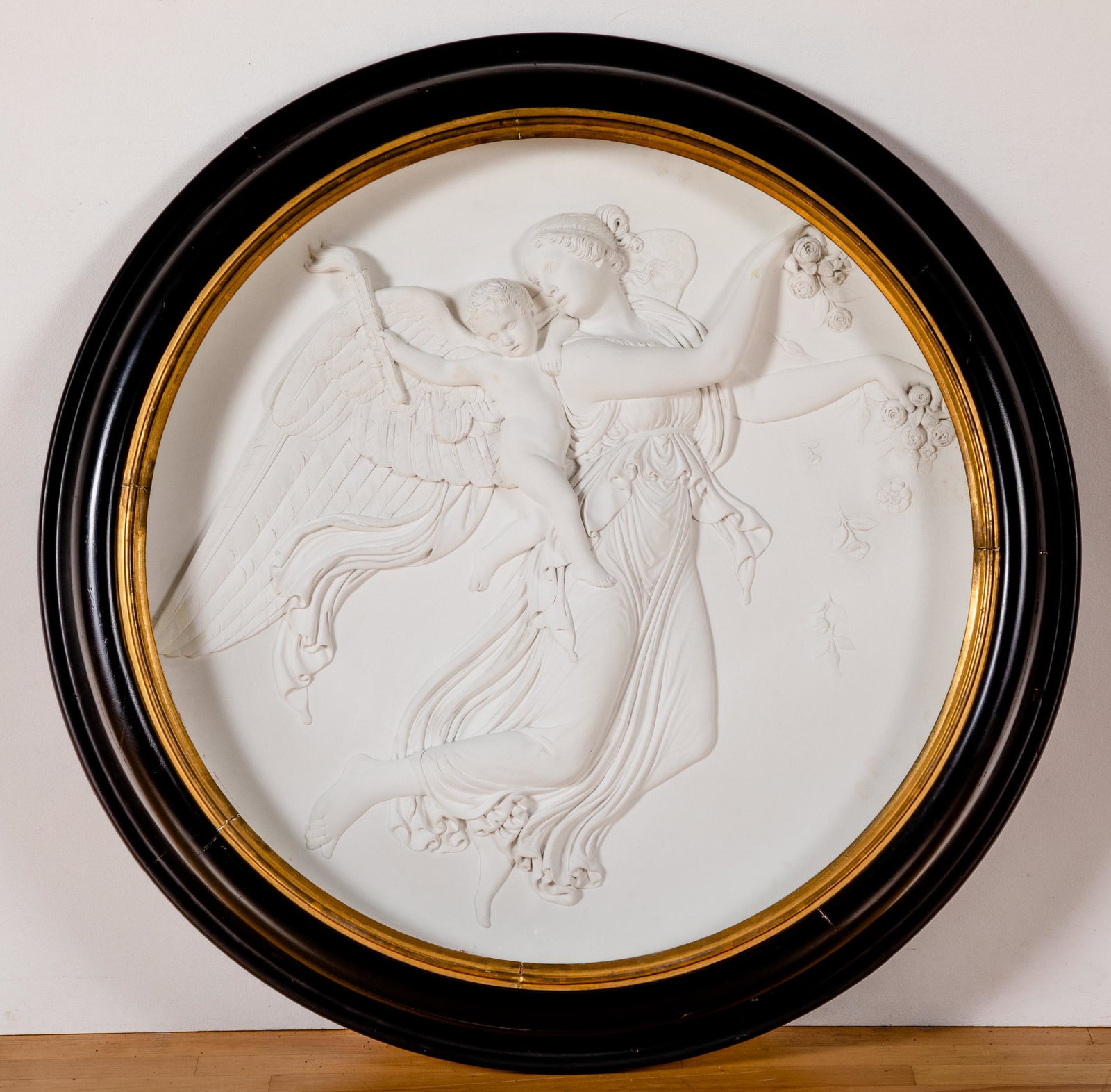 Relief carved plaque of allegorical figures: Large relief carved plaster plaque of two allegorical figures, late 19th c., 32'' dia.