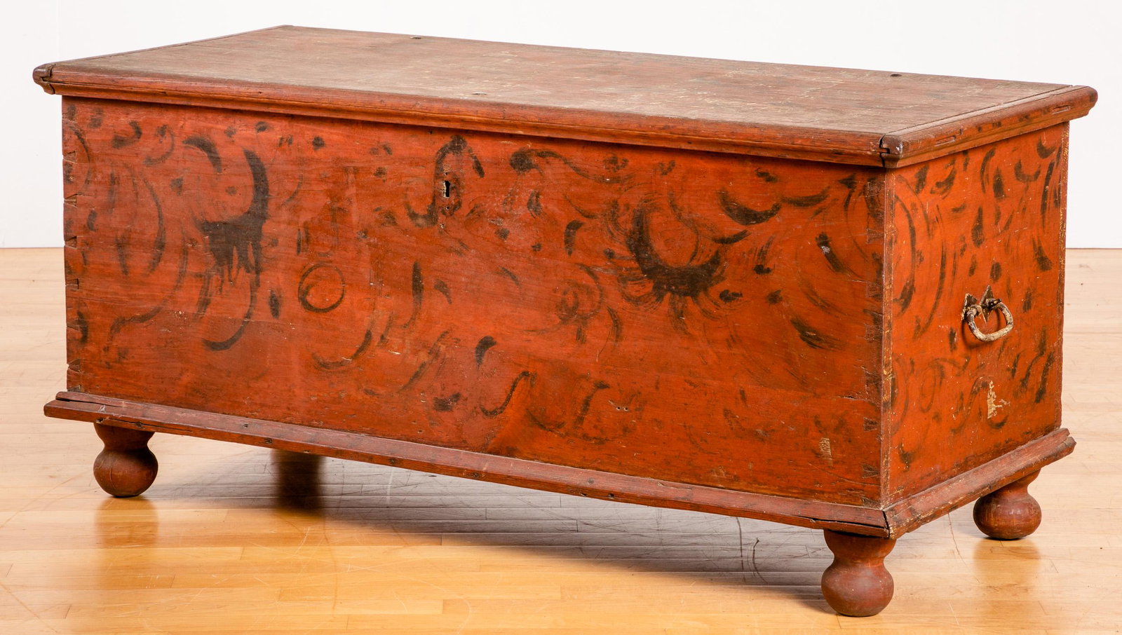Pennsylvania painted dower chest, late 18th c.: Pennsylvania painted dower chest, late 18th c., retaining its original red and black swirl decorated surface, 23 1/2'' h., 48 1/2'' w.