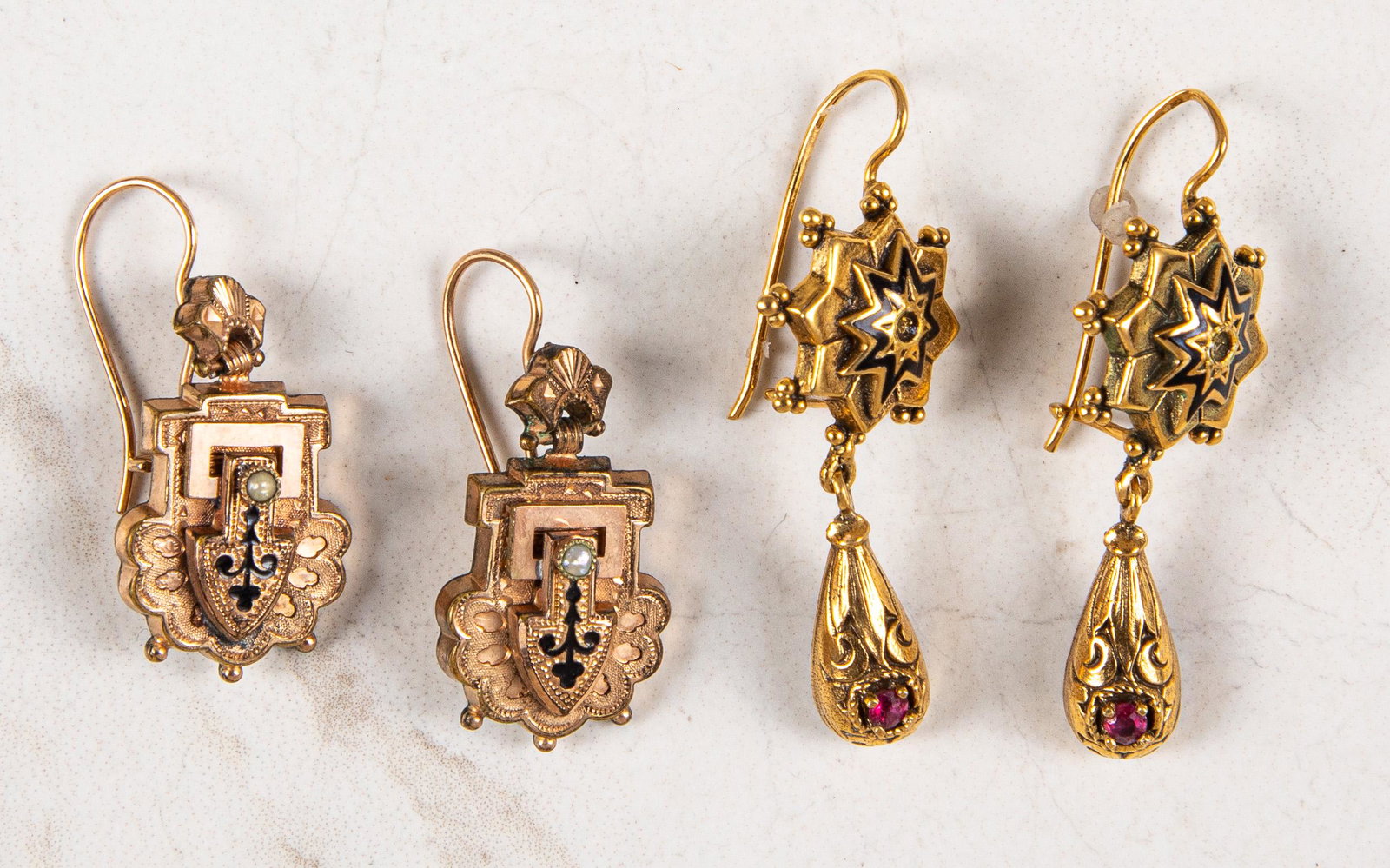 Two pairs of Renaissance Revival earrings: Two pairs of Renaissance Revival earrings, to include a 14K rose gold enamel and gemstone example, 4.2 dwt. and a gold plated enamel and pearl example, longest 5/8'' l.