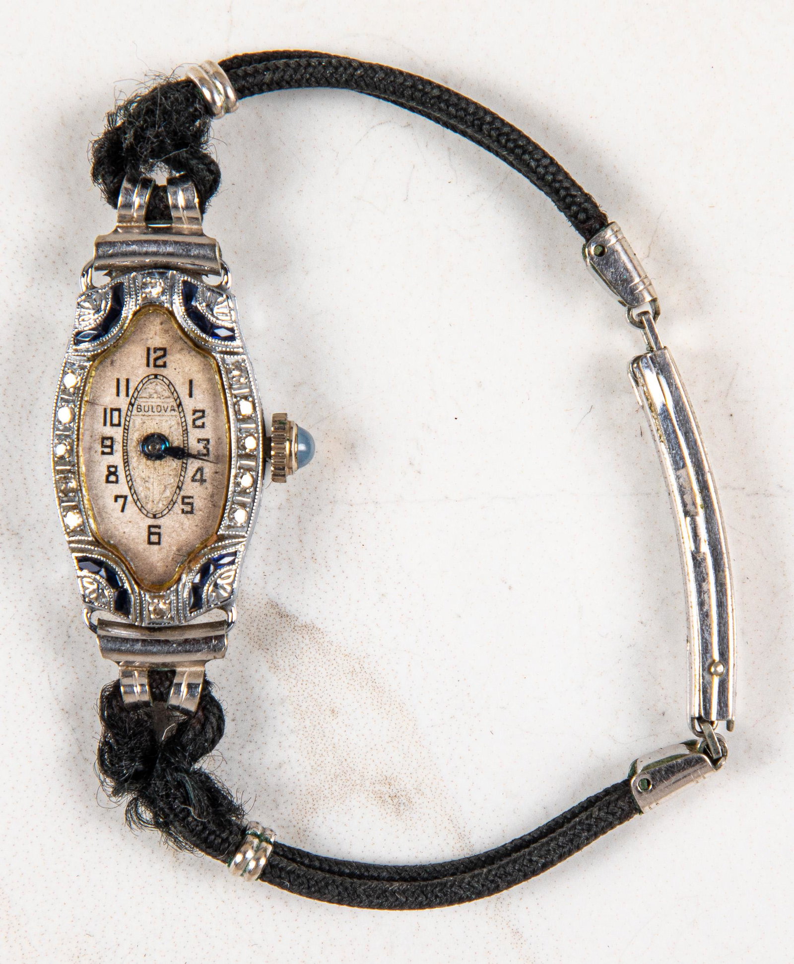 Ladies Bulova sapphire and diamond wrist watch: Ladies Bulova sapphire and diamond wrist watch, with adjustable cord band.