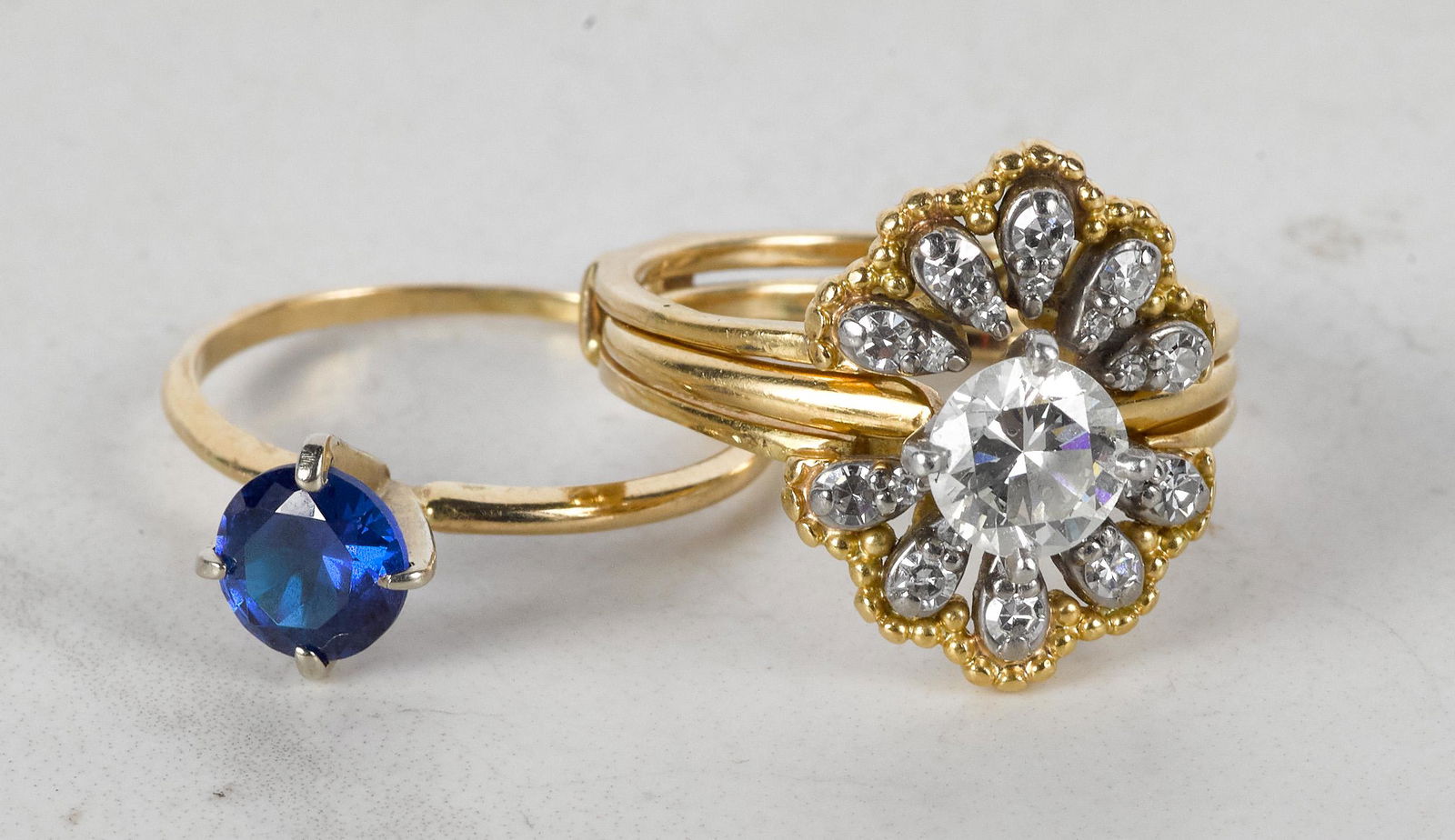 14K gold diamond wedding set: 14K gold diamond wedding set, to include one round brilliant cut diamond solitaire engagement ring weighing approximately 1.02 cts., with G color and VVS2 clarity, placed inside a diamond jacket band