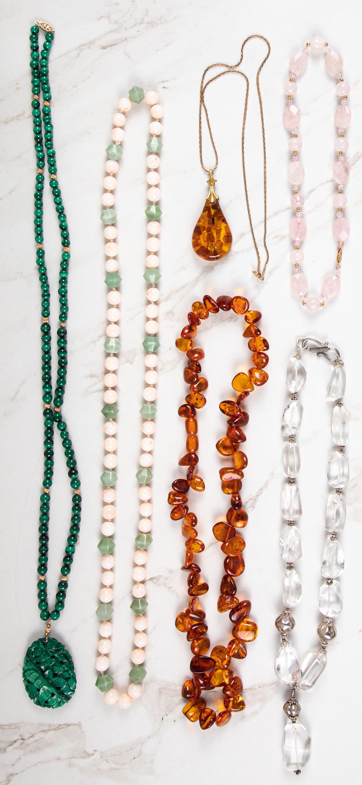 Six semi-precious gemstone necklaces: Six semi-precious gemstone necklaces, to include a malachite example with a carved pendant, a coral and jade example, a rose quartz example, an amber example, etc., malachite - 18 1/2'' l. (with drop)