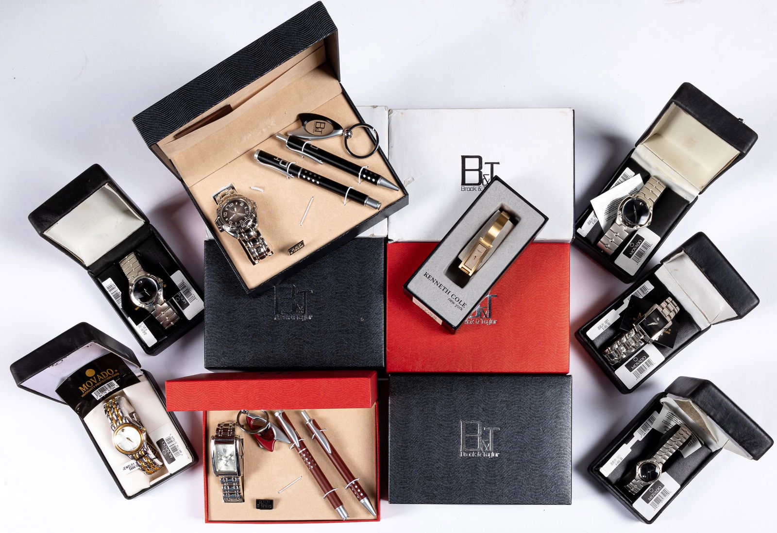 Brook & Taylor wristwatch, keychain and pen, etc.: Seven Brook & Taylor wristwatch, keychain and pen sets, together with five Movado watches and a Kenneth Cole watch.