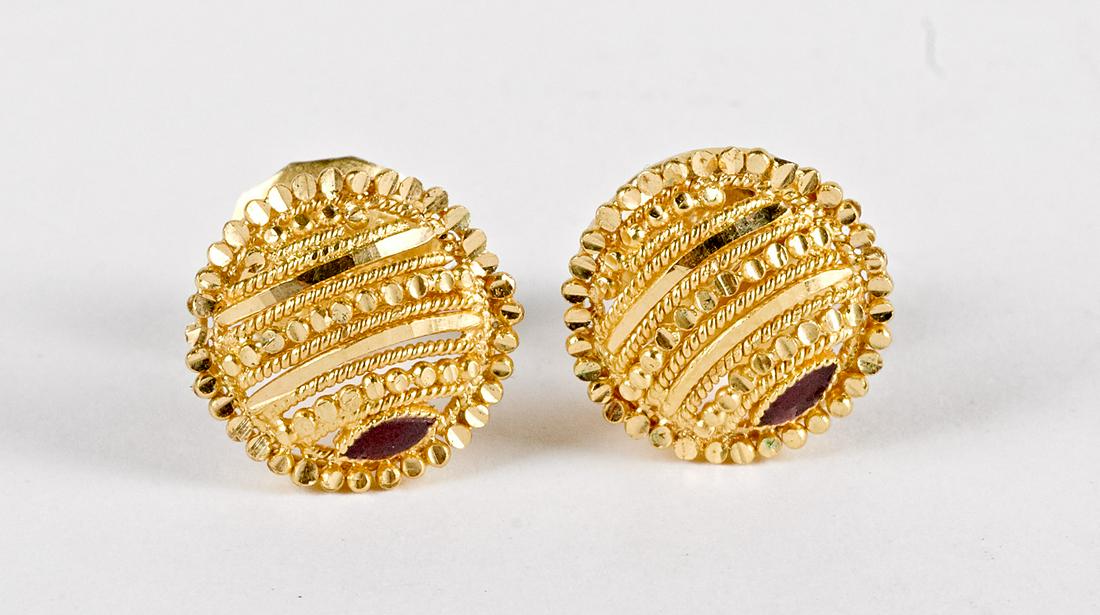 Pair of 22K gold and red stone earrings: Pair of 22K gold and red stone earrings, 4.1 dwt.