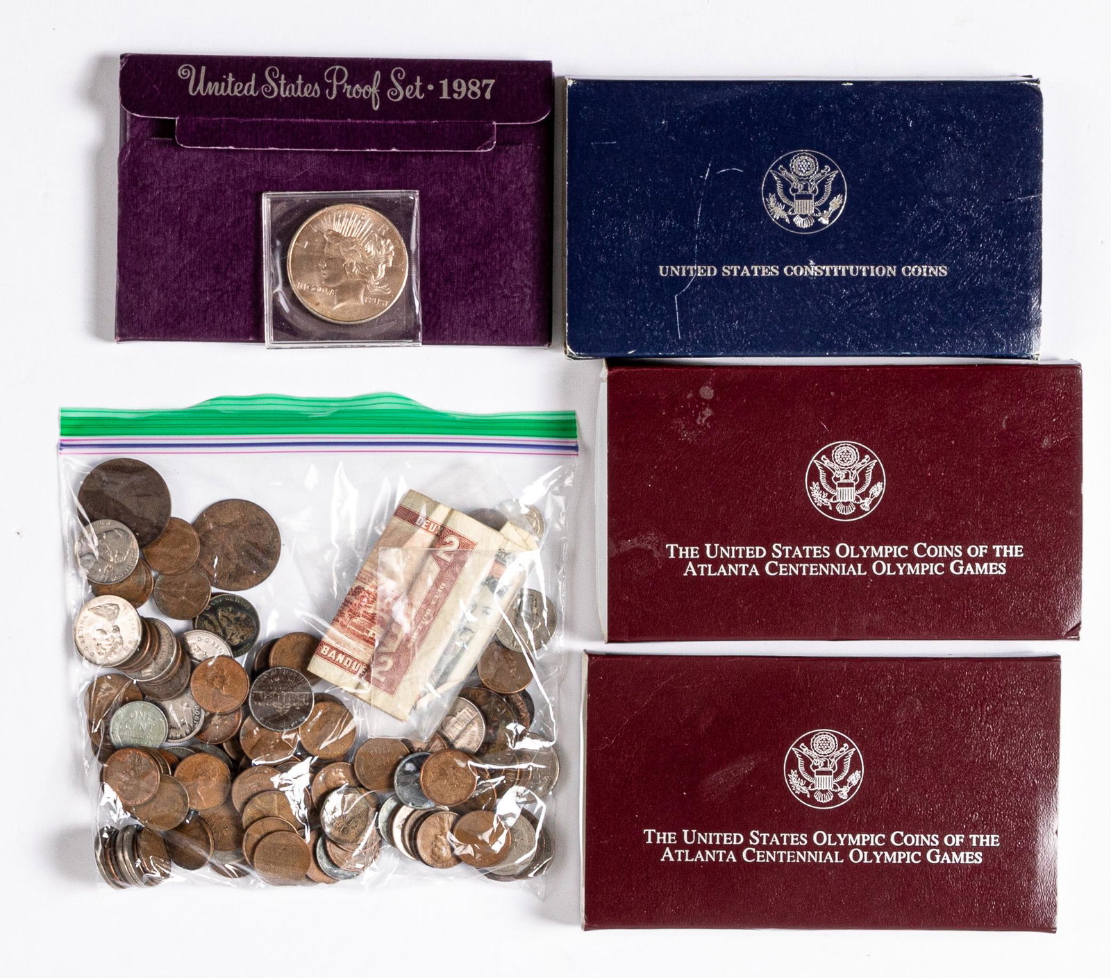 Miscellaneous coins and currency: Miscellaneous coins and currency, to include 1 ozt. fine silver coin, a Constitution coin, 1987 proof set, etc.