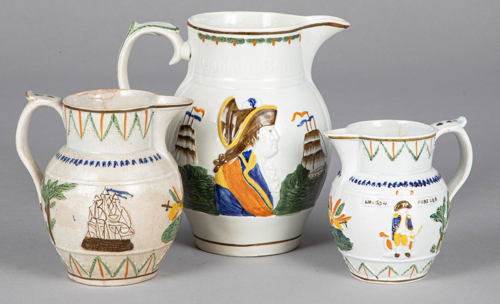 Three Admiral Nelson pearlware pitchers: Three Admiral Nelson pearlware pitchers, 19th c., tallest - 7 1/2''.