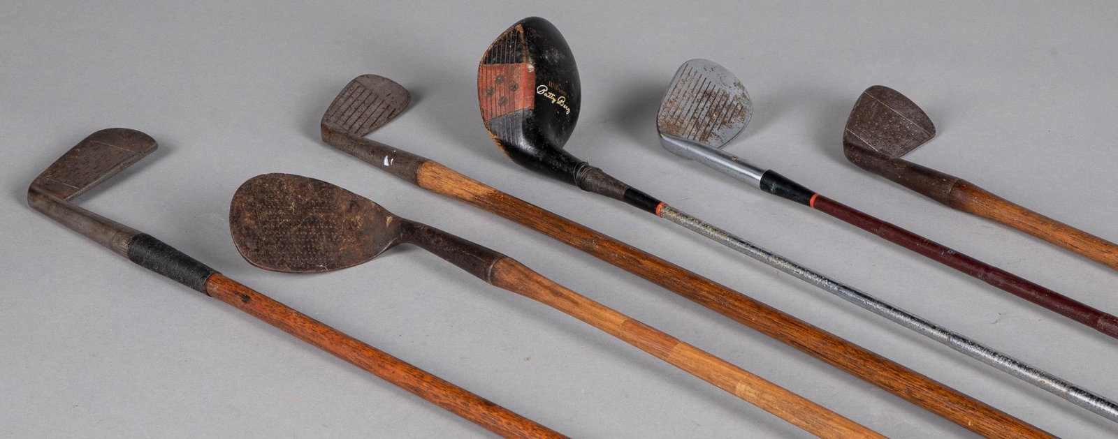 Six early golf clubs: Six early golf clubs.