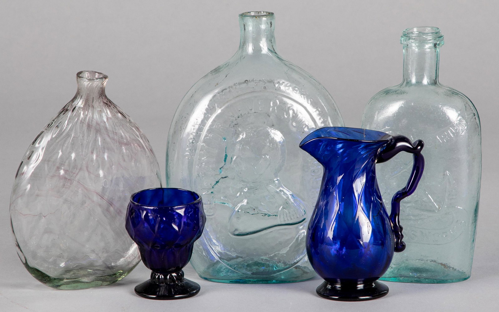 Two Historical aqua glass flasks, etc.: Two Historical aqua glass flasks, to include Washington/Taylor and Spring Garden Glass Works, together with a diamond flask and a Steigel type salt and creamer.