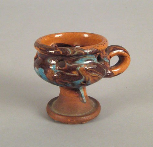 Redware puzzle cup, 19th c., with marble glaze,: Redware puzzle cup, 19th c., with marble glaze, 3'' h.