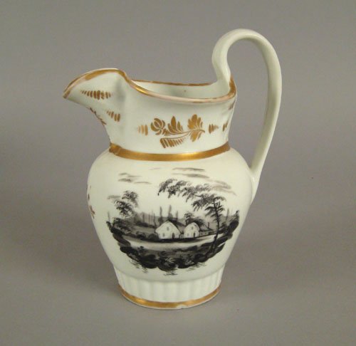 Philadelphia Tucker porcelain pitcher, ca. 1830: Philadelphia Tucker porcelain pitcher, ca. 1830, decorated in grisaille with a landscape with a cottage and gilt highlights, 9 1/4'' h.