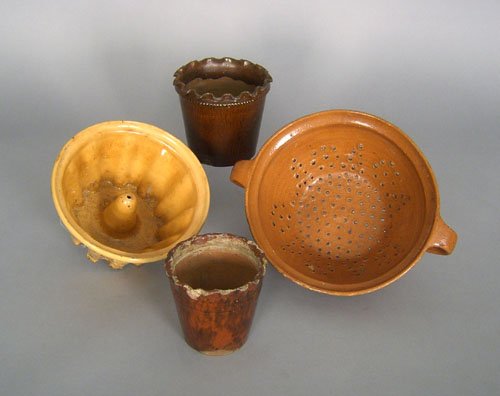 Redware mold, together with a colander and two fl: Redware mold, together with a colander and two flower pots.