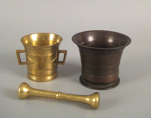 Two brass mortars and a pestle, ca. 1800, 4 1/5