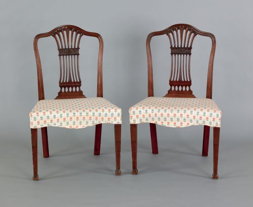 Pair of George III carved mahogany side chairs,