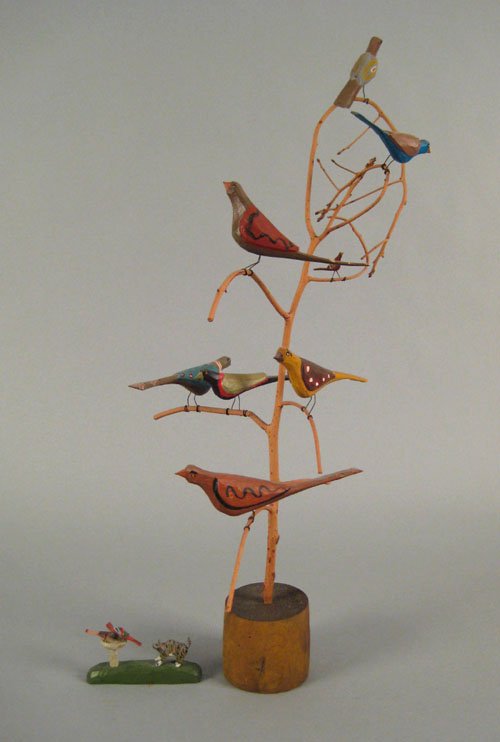 Pennsylvania bird tree by Daniel Strawser 1983,: Pennsylvania bird tree by Daniel Strawser 1983, with eight carved birds, 26'' h., together with a small Strausser carving of a cat at a bird bath, 4 1/2'' l.