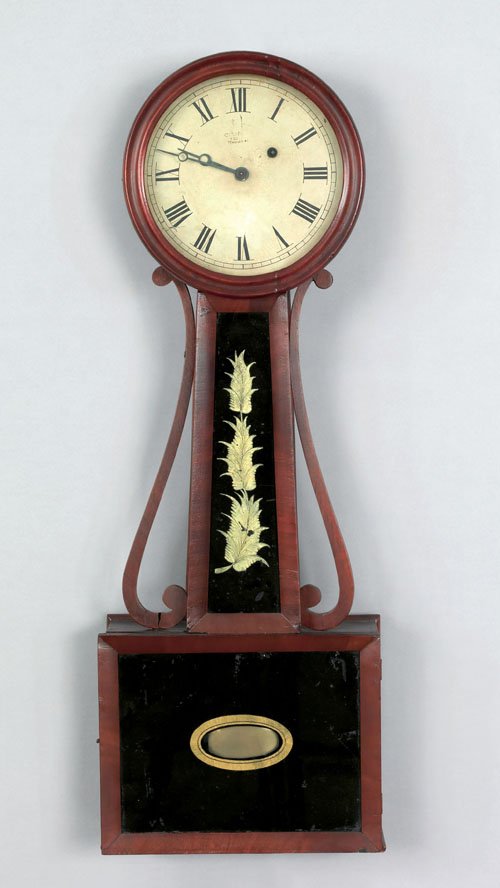 Massachusetts mahogany banjo timepiece, ca. 1830: Massachusetts mahogany banjo timepiece, ca. 1830, with scrolled sidearms and eglomise neck and base panels, 28 3/4'' h.