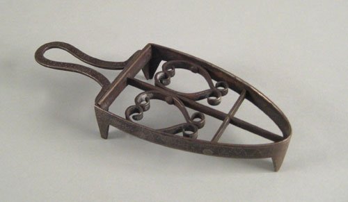 Wrought iron trivet, ca. 1825, with heart motif: Wrought iron trivet, ca. 1825, with heart motif, the sides with pinprick inscribed Anne Thomas.