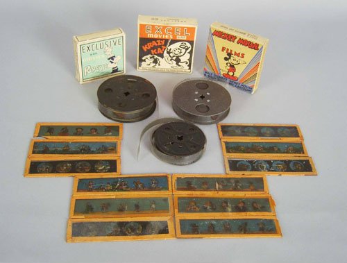 Early projector, together with a magic lantern, t: Early projector, together with a magic lantern, three cartoon reels and a group of slides.