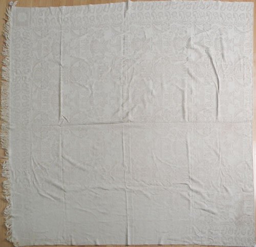 Beige and white coverlet, 86'' x 78''.