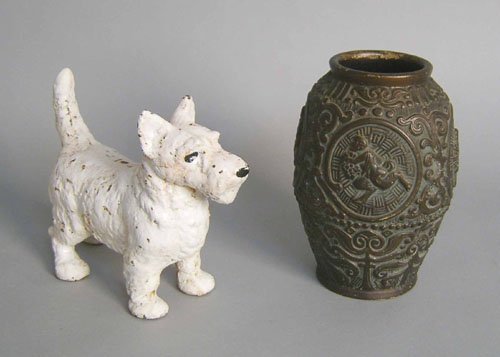 Cast iron dog doorstop, 8 1/4'' h. together with a: Cast iron dog doorstop, 8 1/4'' h. together with a pottery vase, 9 1/4'' h.