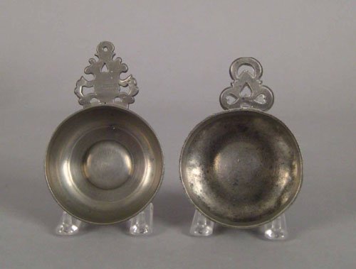 Connecticut pewter porringer, ca. 1835, bearing: Connecticut pewter porringer, ca. 1835, bearing the touch of Thomas & Sherman Boardman, 1 1/4'' h., 3 1/4'' dia., together with a New England porringer marked R.