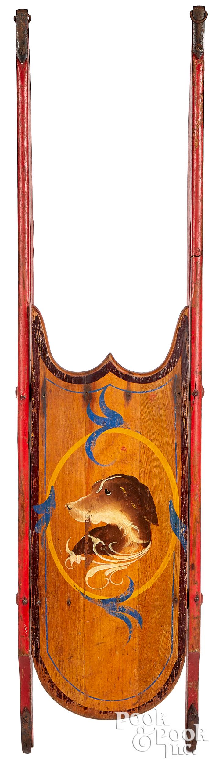 Painted sled, decorated with a dogs head (1 of 2)