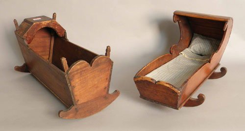 Two pine doll cradles, 13'' h., 23'' w. and 12'' h: Two pine doll cradles, 13'' h., 23'' w. and 12'' h., 21 1/2'' w.