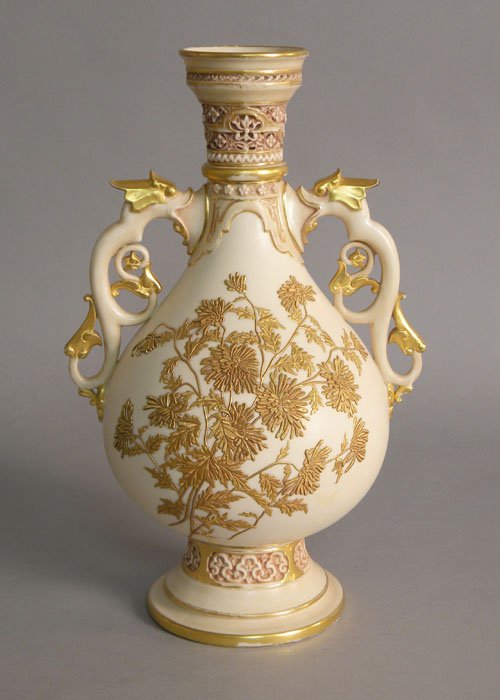 Royal Worcester baluster vase with griffin handle: Royal Worcester baluster vase with griffin handles and raised gilt floral decoration, 13'' h.