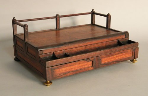 George III mahogany rosewood desk box with a rail: George III mahogany rosewood desk box with a railing, pen tray, and single drawer, ca. 1800.