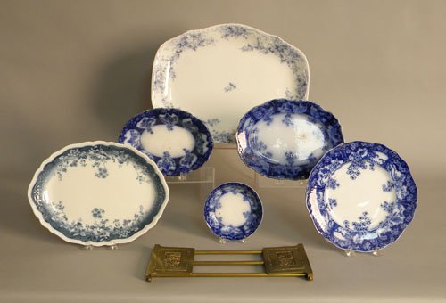 Four flow blue serving pieces, two ironstone plat: Four flow blue serving pieces, two ironstone platters, and Bradley and Hubbard brass bookends.