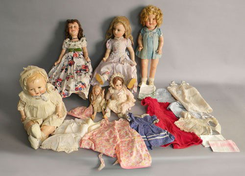 Ideal Shirley Temple doll, 20'' h., together with: Ideal Shirley Temple doll, 20'' h., together with five other character and baby dolls and doll clothes.