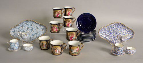 Eight demitasse cups and saucers with cobalt back: Eight demitasse cups and saucers with cobalt background and painted scene together with two Spode miniature tea sets.